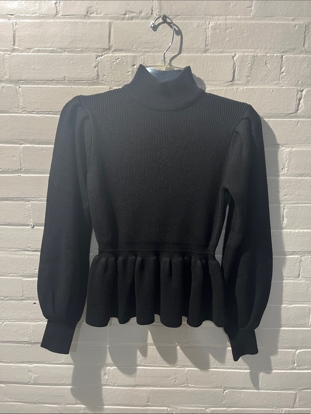 Black Ribbed Peplum Turtleneck Sweater